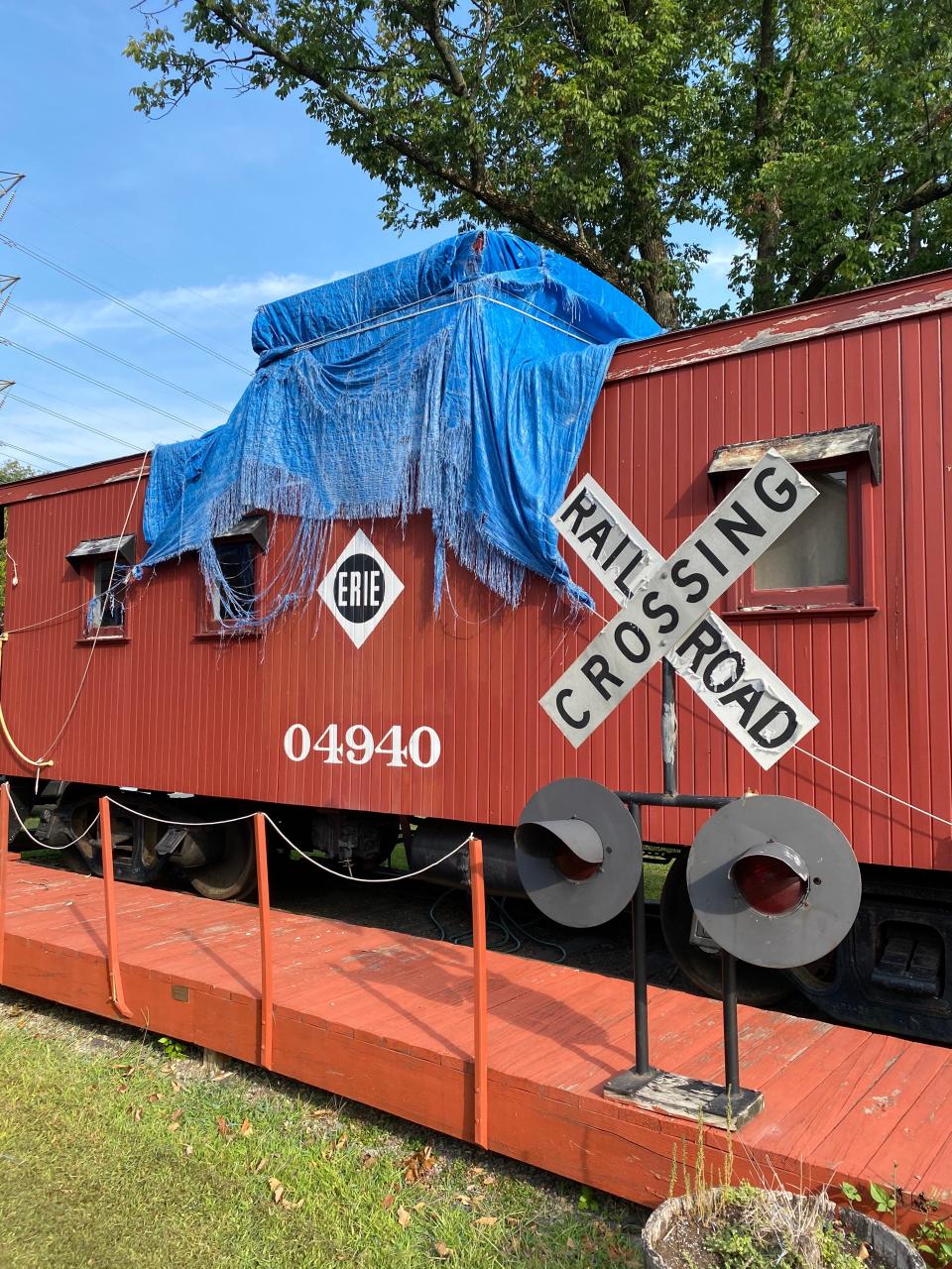 The Mahwah caboose's "cupola" through which conductors could keep an eye on the train in front of them has sustained water damage and is now covered with a tarp.