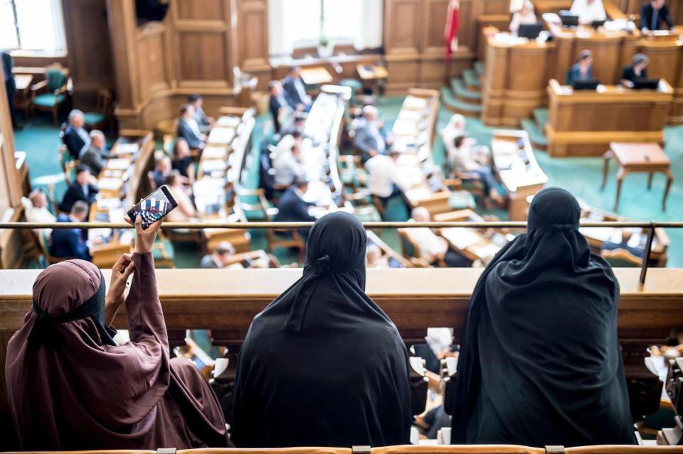 Women wearing niqabs sit in the&nbsp;gallery at the Danish Parliament in Copenhagen on Thursday. (Photo: MADS CLAUS RASMUSSEN via Getty Images)