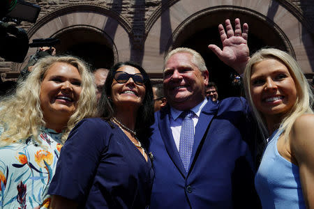 Ontario Premier Doug Ford is pictured with his family following his unofficial swearing in ceremony in Toronto, Ontario, Canada, June 29, 2018. REUTERS/Carlo Allegri