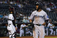 Miami Marlins' Bryan De La Cruz scores on a double hit by Joey Wendle during the ninth inning of a baseball game against the Arizona Diamondbacks, Wednesday, May 10, 2023, in Phoenix. (AP Photo/Matt York)