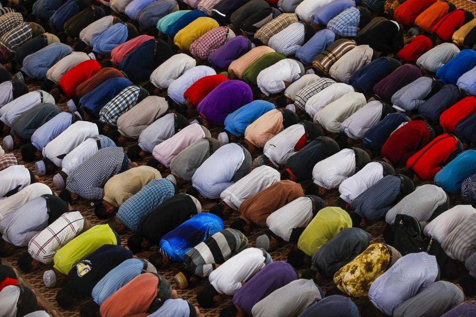 Muslims attend Friday prayers at the National Mosque in Kuala Lumpur