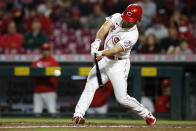 Cincinnati Reds' Max Schrock hits a triple against the Washington Nationals during the ninth inning of a baseball game Thursday, Sept. 23, 2021, in Cincinnati. The Nationals beat the Reds 3-2. (AP Photo/Jay LaPrete)