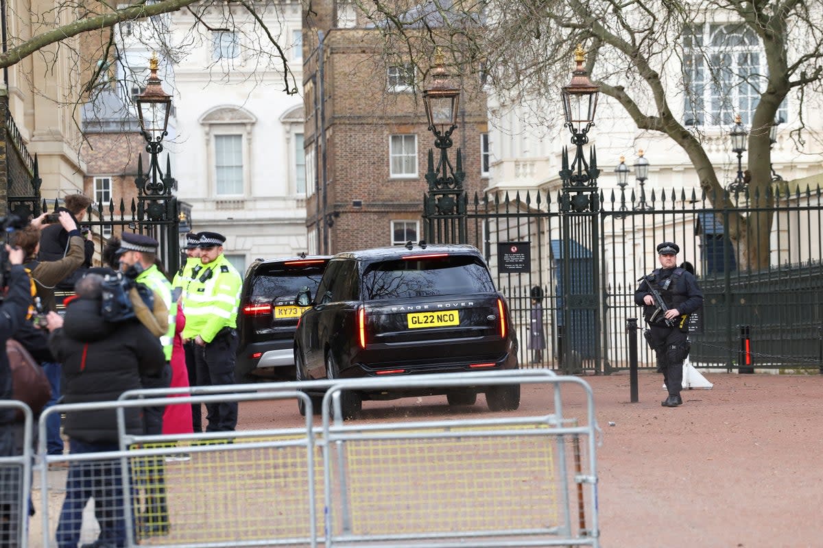 A car believed to be transporting Prince Harry enters Clarence House, the home of King Charles (REUTERS)