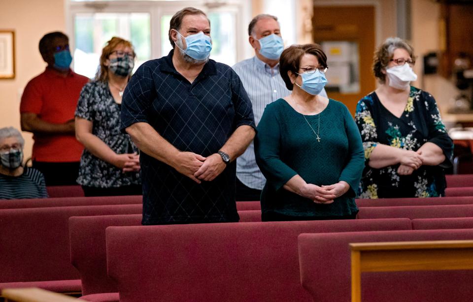 Parishioners gather for daily Mass at Holy Spirit Catholic Church on May 21, 2020, in Mustang, Okla.