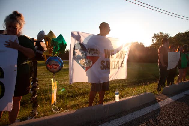 Students are welcomed back to Santa Fe High School after a 17-year-old boy fatally shot 10 people on the campus in Santa Fe, Texas, on May 29, 2018. Family members of those killed and injured expressed concern Thursday that the case against the accused gunman — delayed for years over questions of his mental competence — faces further delays.