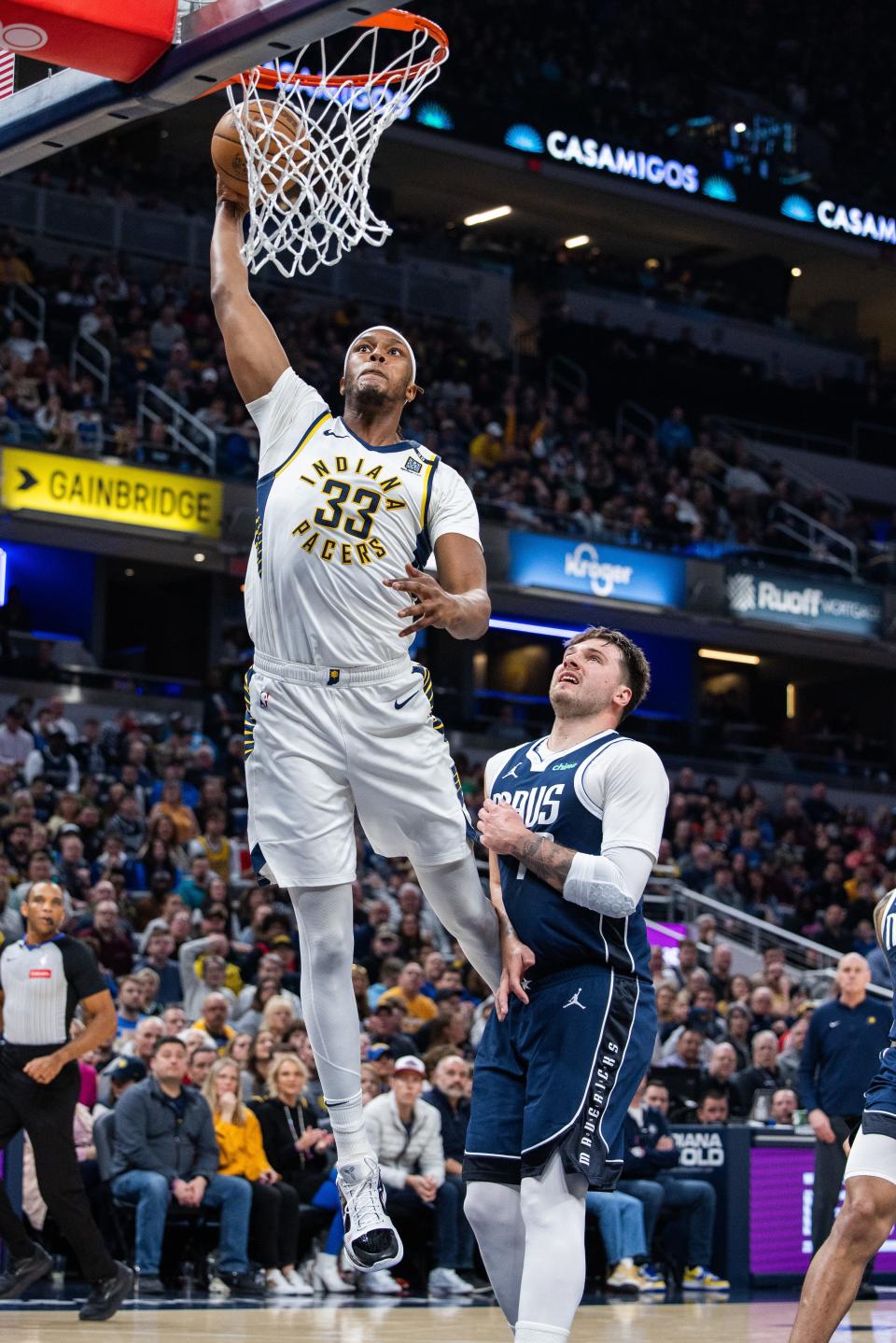 Feb 25, 2024; Indianapolis, Indiana, USA; Indiana Pacers center Myles Turner (33) shoots the ball while Dallas Mavericks guard Luka Doncic (77) defends in the first half at Gainbridge Fieldhouse. Mandatory Credit: Trevor Ruszkowski-USA TODAY Sports