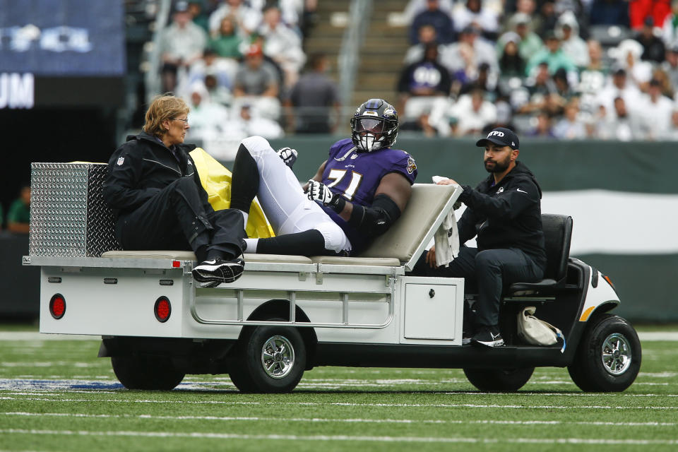 Baltimore Ravens offensive tackle Ja'Wuan James (71) is carted off the field during the first half of an NFL football game against the New York Jets, Sunday, Sept. 11, 2022, in East Rutherford, N.J. (AP Photo/John Munson)