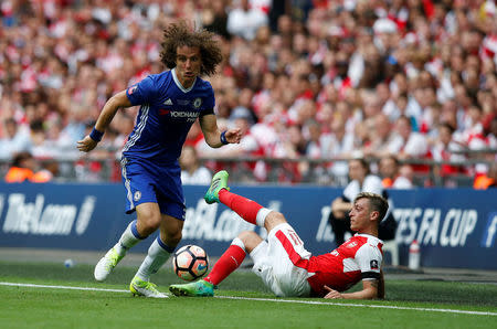 Britain Soccer Football - Arsenal v Chelsea - FA Cup Final - Wembley Stadium - 27/5/17 Chelsea’s David Luiz in action with Arsenal’s Mesut Ozil Reuters / Andrew Yates