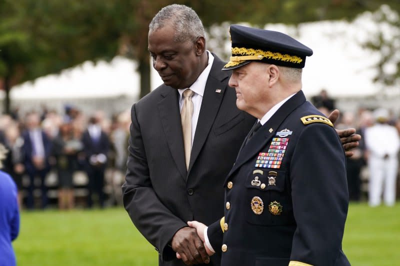 Lloyd Austin, United States Secretary of Defense, shakes hands with General Mark A. Milley during a ceremony at the Armed Forces Farewell Tribute in honor of Milley, the 20th Chairman of the Joint Chiefs of Staff, in Virginia on Friday. Photo by Nathan Howard/UPI