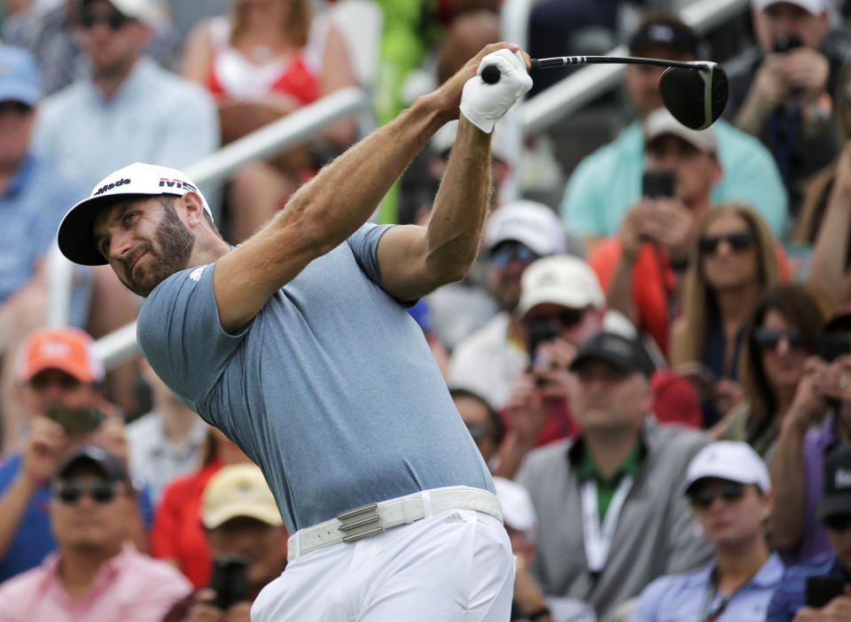 Dustin Johnson drives off the first tee during the final round of the PGA Championship golf tournament, Sunday, May 19, 2019, at Bethpage Black in Farmingdale, N.Y. (AP Photo/Seth Wenig)