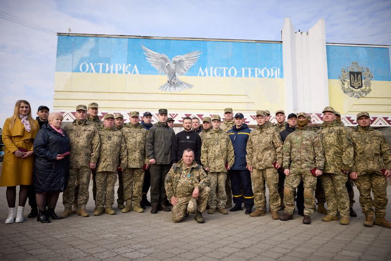 Ukraine's President Volodymyr Zelenskiy visits the town of Okhtyrka in Sumy region