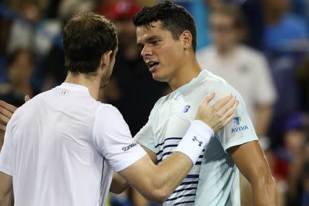 Aug 20, 2016; Mason, OH, USA; Andy Murray (GBR), left, meets with Milos Raonic (CAN), right, after their match in the semifinals during the Western and Southern tennis tournament at Linder Family Tennis Center. Mandatory Credit: Aaron Doster-USA TODAY Sports