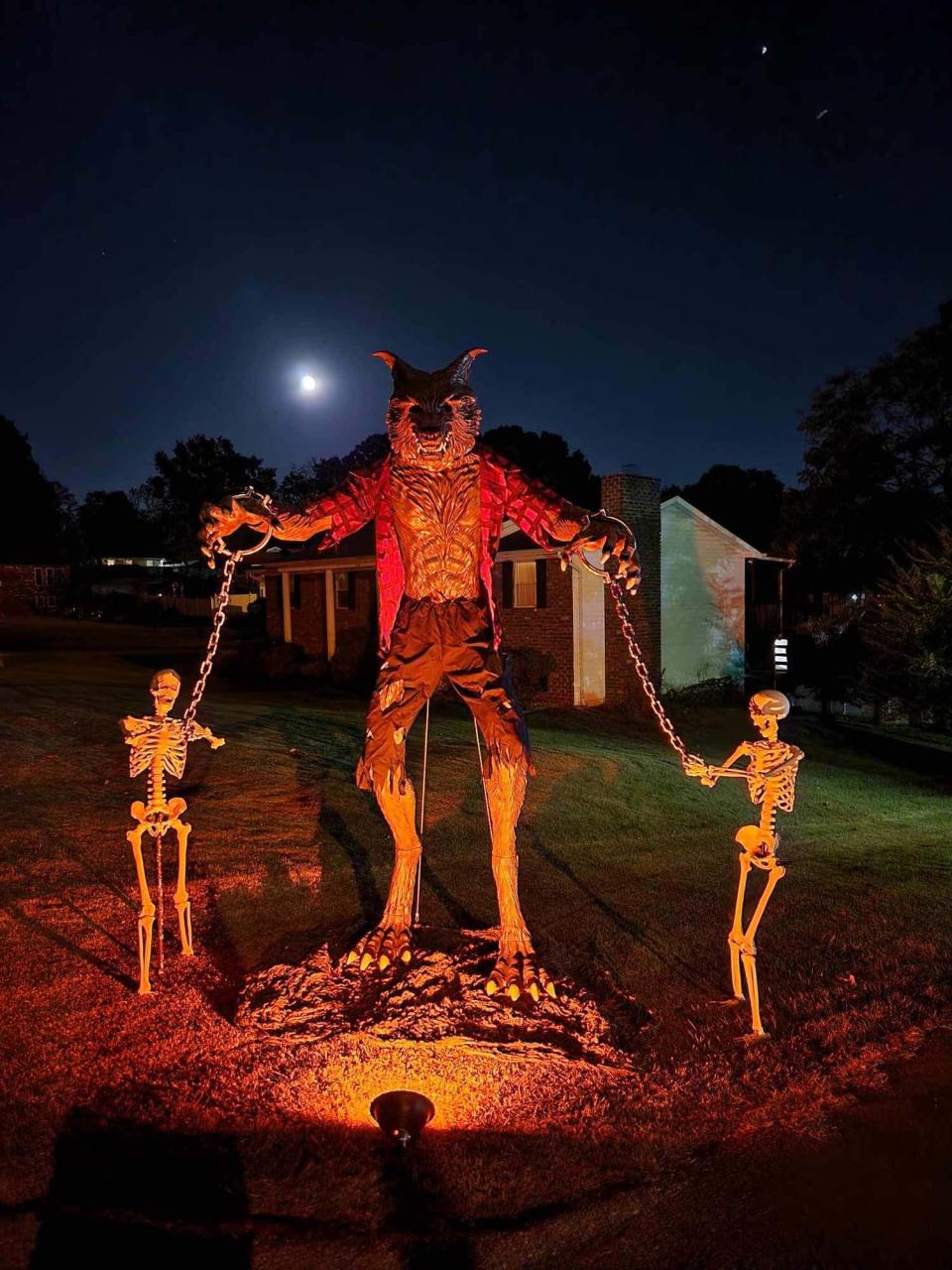 A 12-foot-tall werewolf growls and howls at the McNutt home, welcoming visitors to explore the well decorated yard at 1231 Venido Drive in Knoxville, Tennessee … and scaring away local dogs who refuse to walk by it. Sept. 24, 2023.