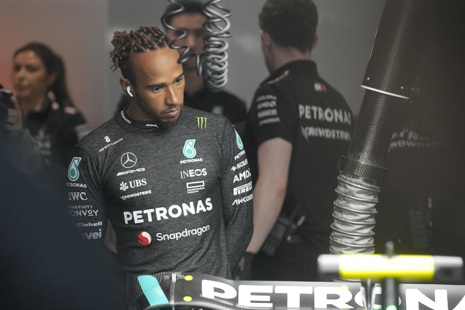 Mercedes driver Lewis Hamilton, of Britain, looks at his car before the second practice session for the Formula One Las Vegas Grand Prix auto race, Friday, Nov. 17, 2023, in Las Vegas. (AP Photo/Darron Cummings)