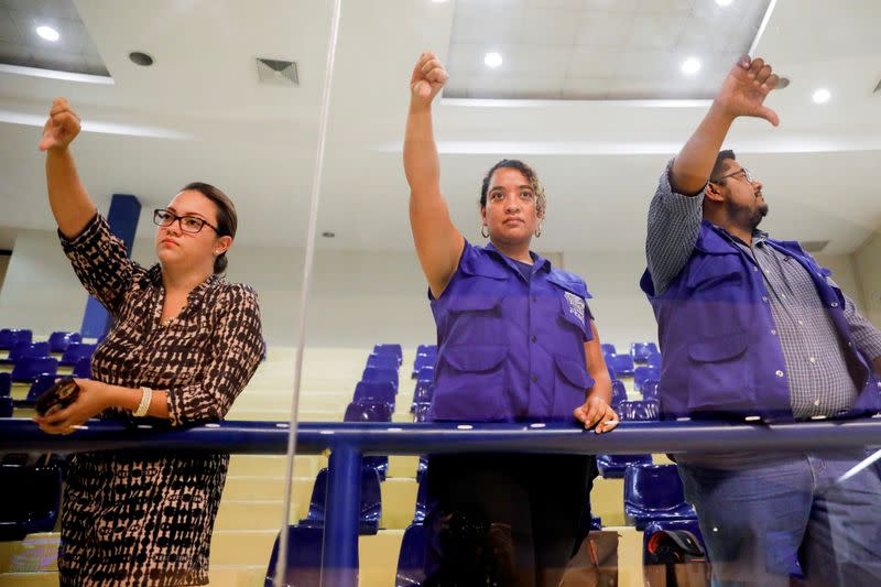 Human rights activists react during a congress session against approving of an amnesty bill that exempts the prosecution of crimes committed during the civil war, in San Salvador, El Salvador