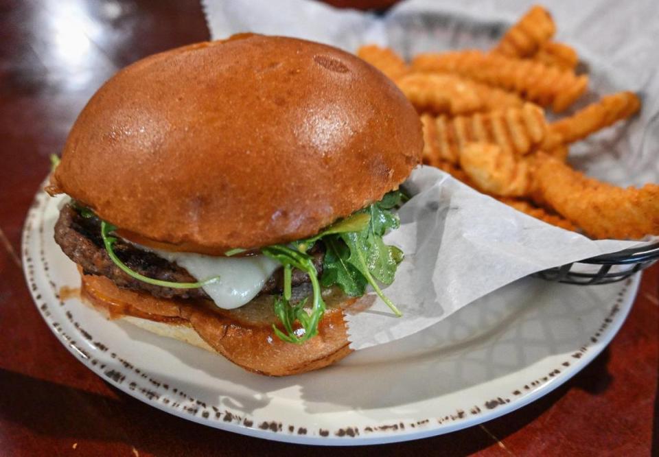 A gourmet cheeseburger and fries served up in a restaurant-style setting at the new Papa Mike’s Café which opened officially with a ribbon cutting at the Poverello House on Wednesday, Jan. 24, 2024.