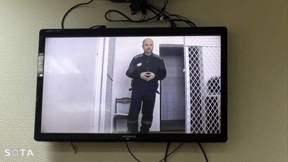 In this photo taken from video released by Russian independent news outlet SOTA Telegram channel, Russian opposition activist Vladimir Kara-Murza appears in a video feed from a Siberian penal colony on Thursday, Feb. 22, 2024. The video was beamed by the Russian Federal Penitentiary Service to a hearing at the Zamoskvoretsky court in Moscow on allegations by Kara-Murza. In the video, Kara-Murza urged Russians to keep fighting for democracy despite the death of Alexei Navalny in prison. (Russian independent news outlet SOTA telegram channel via AP)