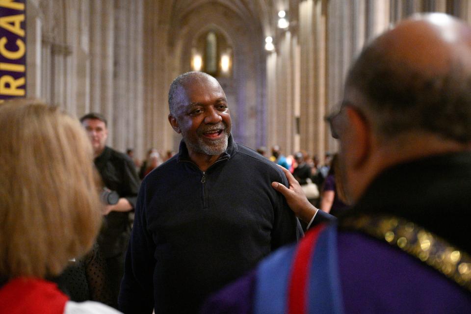 Artist Kerry James Marshall, center, speaks to attendees after an unveiling and dedication ceremony Saturday at the Washington National Cathedral for the new stained-glass windows. Marshall, who was born in Birmingham in 1955, invited anyone viewing the new windows, or other artworks inspired by social justice, “to imagine oneself as a subject and an author of a never-ending story is that is still yet to be told.”