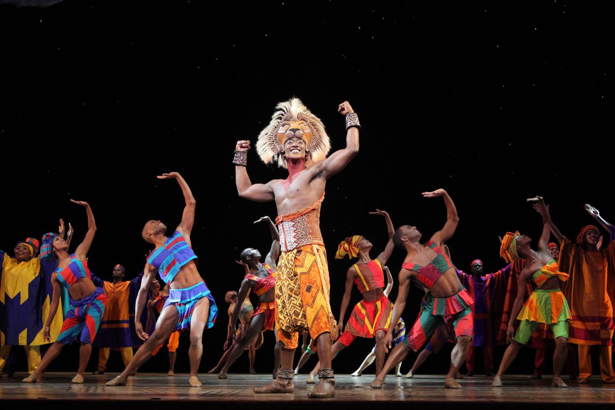 An elaborate headdress helps create the young lion Simba’s costume in “The Lion King.”
