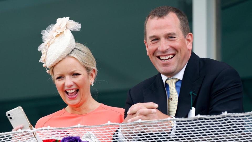 Lindsay Wallace and Peter Phillips watch the racing from the royal box as they attend The Epsom Derby at Epsom Racecourse on June 4, 2022 in Epsom, England.