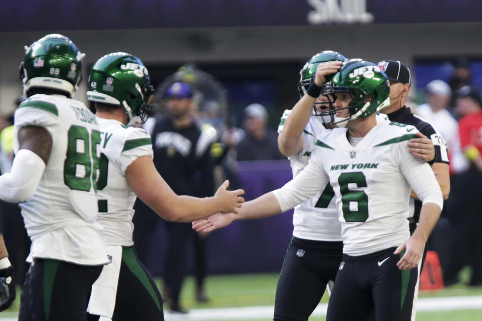 New York Jets place kicker Greg Zuerlein (6) celebrates with teammates after kicking a 60-yard field goal during the first half of an NFL football game against the Minnesota Vikings, Sunday, Dec. 4, 2022, in Minneapolis. (AP Photo/Andy Clayton-King)