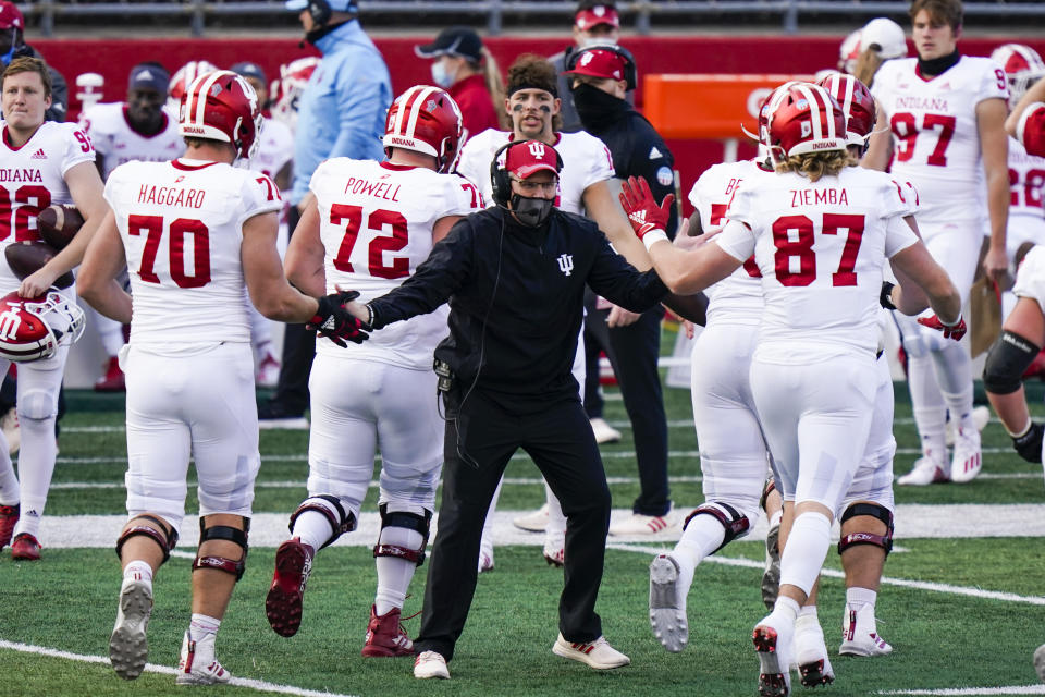 Indiana coach Tom Allen congratulates players during the second quarter of an NCAA college football game against Rutgers, Saturday, Oct. 31, 2020, in Piscataway, N.J. (AP Photo/Corey Sipkin)