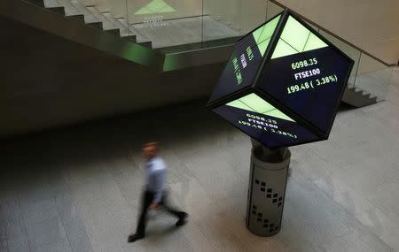 A man walks through the lobby of the London Stock Exchange in London, Britain August 25, 2015. REUTERS/Suzanne Plunkett