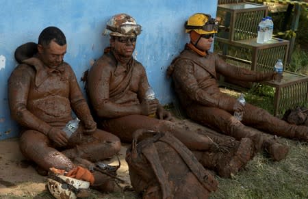 FILE PHOTO: Members of a rescue team react upon returning from the mission, after a tailings dam owned by Brazilian mining company Vale SA collapsed, in Brumadinho