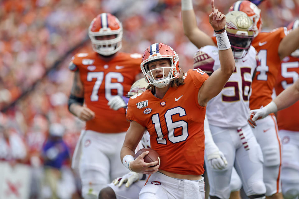 Clemson quarterback Trevor Lawrence (16) reacts after scoring a touchdown during the first half of an NCAA college football game against Florida State, Saturday, Oct. 12, 2019, in Clemson, S.C. (AP Photo/Richard Shiro)