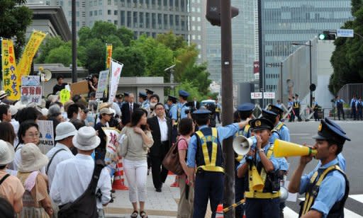 This file photo shows anti-nuclear protesters staging a demonstration outside the prime minister's official residence in Tokyo, on July 27. Weekly demonstrations outside the prime minister's residence have drawn tens of thousands of people and a rally in west Tokyo earlier this month saw a crowd that organisers claimed was about 170,000-strong