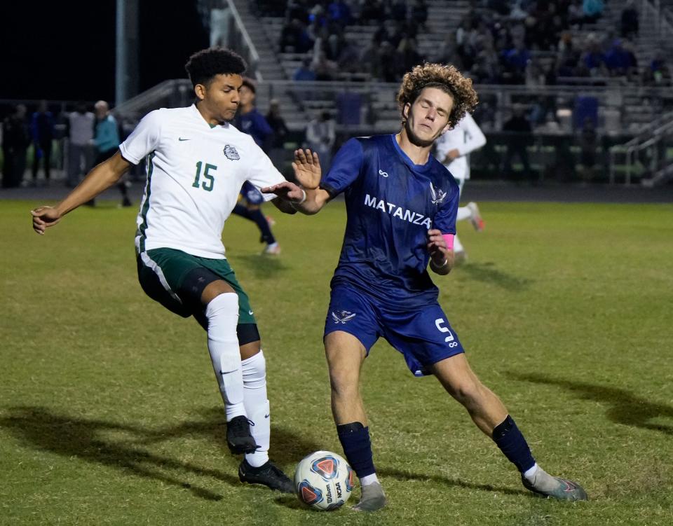 Flagler Palm Coast's Mikhail Zysek (15) battles with Matanzas Nedas Jaronis (5) during a match at Matanzas High School in Palm Coast, Tuesday, Dec.5, 2023.