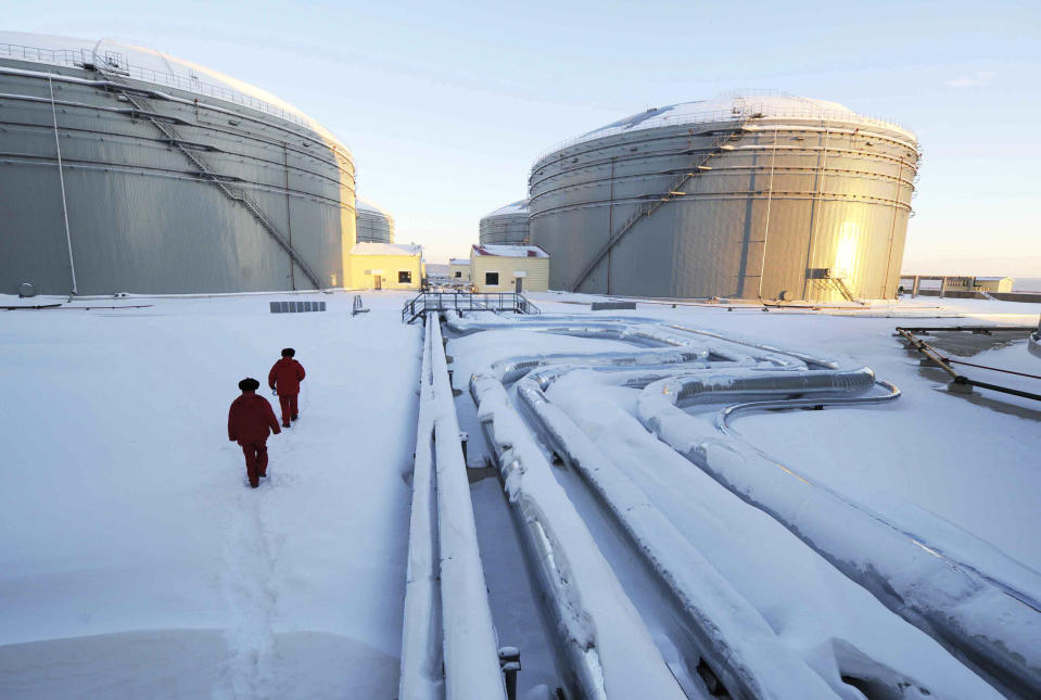 FILE - In this photo released by China's Xinhua News Agency, workers inspect the pipelines and oil storage tanks of a nearly 1, 000-kilometer (625-miles) -long China and Russia crude oil pipeline in Mohe, northeast China's Heilongjiang Province on Jan. 1, 2011. China’s support for Russia through oil and gas purchases is irking Washington and raising the risk of U.S. retaliation, foreign observers say, though they see no sign Beijing is helping Moscow evade sanctions over its war on Ukraine. (Wang Jianwei/Xinhua via AP, File)