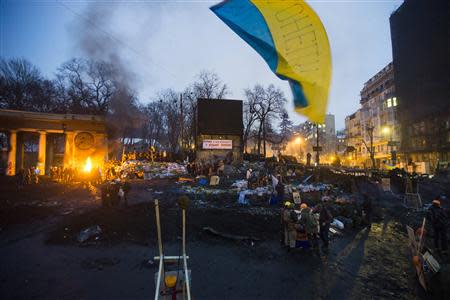 A general view shows an anti-government protesters' camp built as a fortification against riot police in Kiev, January 28, 2014. REUTERS/Thomas Peter