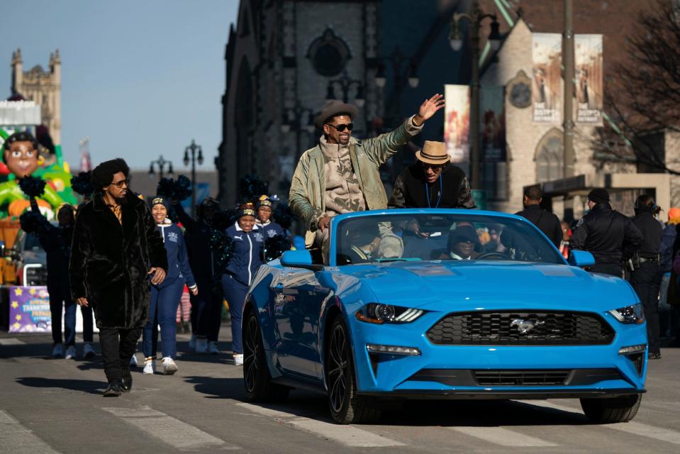 Grand marshal Jalen Rose waves to attendees during the 96th America's Thanksgiving Parade along Woodward Avenue in downtown Detroit on Thursday, Nov. 24, 2022.