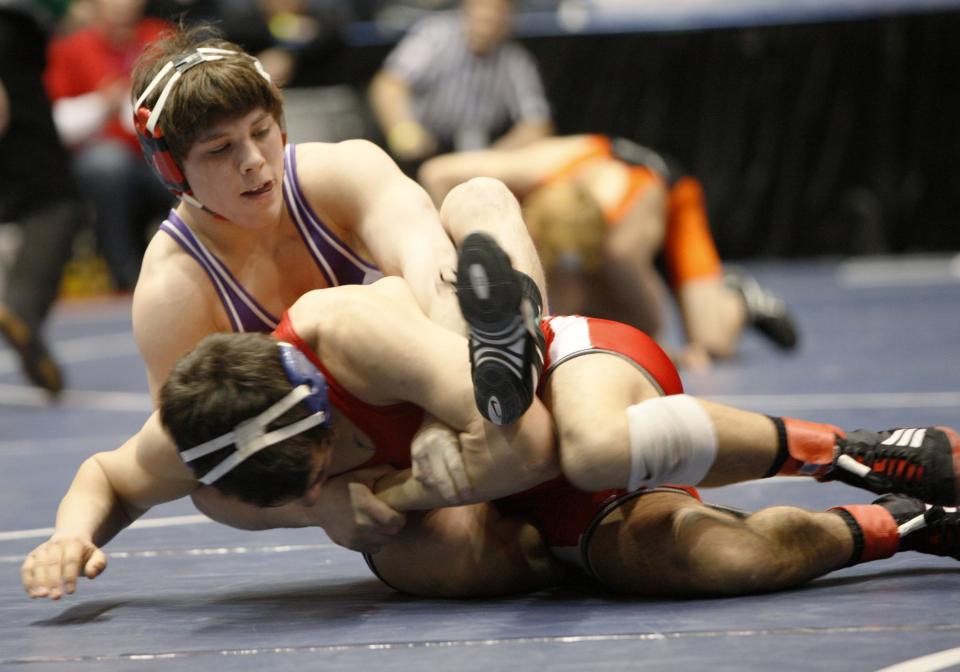 Letchworth's Mike Nevinger, top, grapples with Harpursville's Victor Coronado during the semifinal rounds of the high school wrestling state championships at the Blue Cross Arena in 2008.