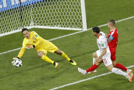 <p>Serbia goalkeeper Vladimir Stojkovic, left, blocks a shoot from Switzerland’s Blerim Dzemaili, centre, during the group E match between Switzerland and Serbia at the 2018 soccer World Cup in the Kaliningrad Stadium in Kaliningrad, Russia, Friday, June 22, 2018. (AP Photo/Antonio Calanni) </p>