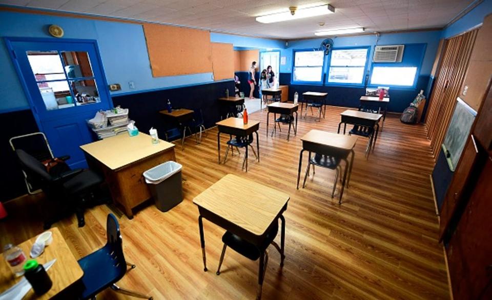 <span class="caption">Children in a pre-school class wear masks and sit at desks spaced apart as per coronavirus guidelines during summer school sessions in Monterey Park, California on July 9, 2020.</span> <span class="attribution"><a class="link " href="https://www.gettyimages.com/detail/news-photo/children-in-a-pre-school-class-wear-masks-and-sit-at-desks-news-photo/1226007157?adppopup=true" rel="nofollow noopener" target="_blank" data-ylk="slk:Frederic J. Brown/Getty Images;elm:context_link;itc:0;sec:content-canvas">Frederic J. Brown/Getty Images</a></span>