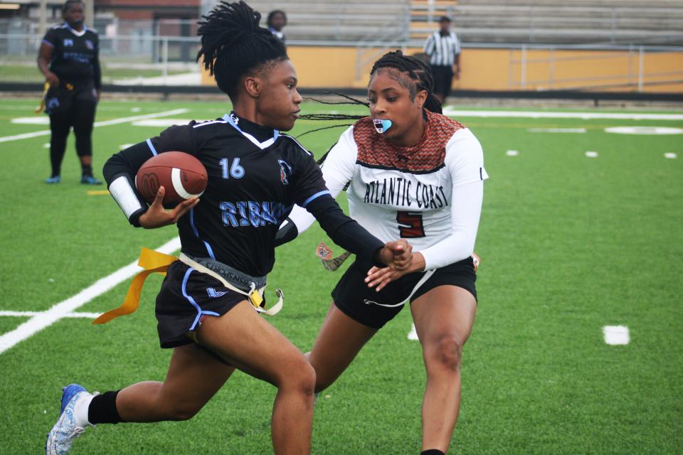 Atlantic Coast's Kylie Johnson (5) makes a flag pull against Ribault during the Gateway Conference high school flag football tournament on Tuesday.