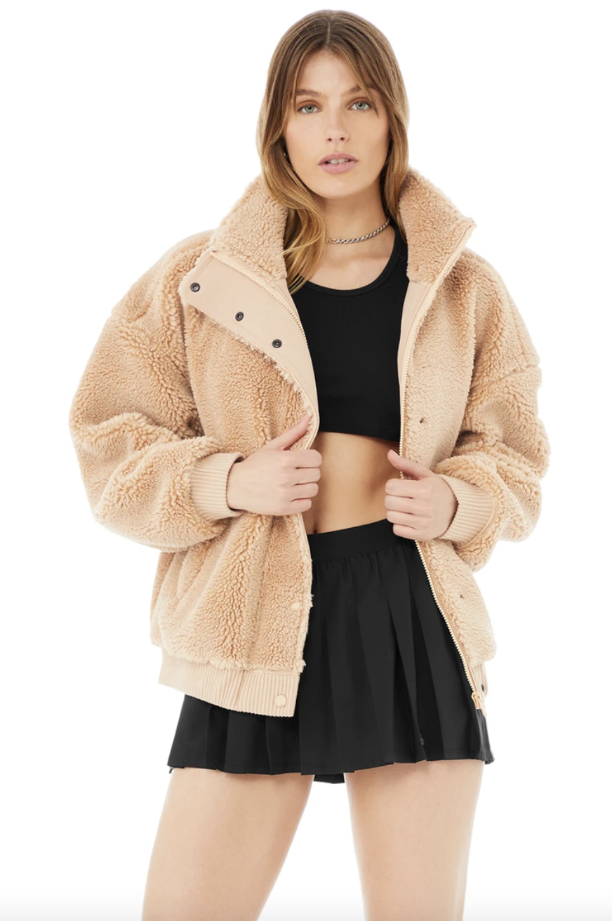 Sherpa Varsity Jacket in camel with black mini skirt