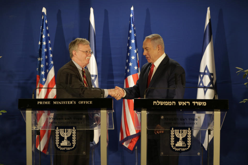 FILE - In this Jan. 6, 2019, file photo, Israeli Prime Minister Benjamin Netanyahu, right, shakes hands with national security adviser John Bolton following their meeting, in Jerusalem. (AP Photo/Oded Balilty, Pool, file)