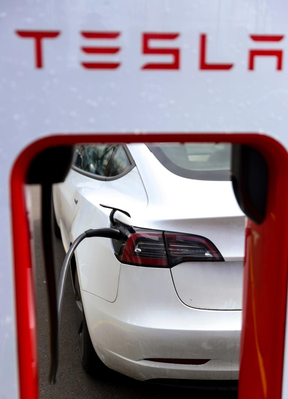 Teslas charge at an electric vehicle charging station at a Target, Tuesday, April 11, 2023, in Salem, Ore.