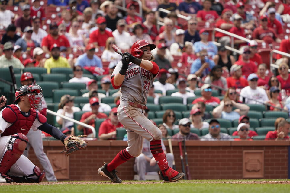 Cincinnati Reds' TJ Friedl hits an RBI triple during the seventh inning of a baseball game against the St. Louis Cardinals Sunday, June 12, 2022, in St. Louis. (AP Photo/Jeff Roberson)