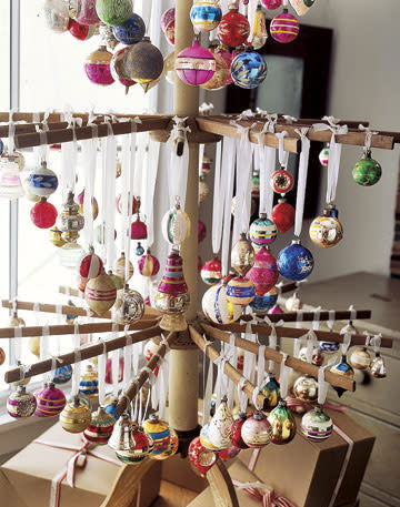 Hang ornaments from an antique drying rack to create an alternative Christmas tree.