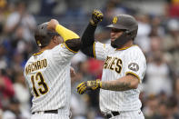 San Diego Padres' Gary Sanchez, right, celebrates with teammate Manny Machado after hitting a two-run home run during the second inning of a baseball game against the Chicago Cubs, Monday, June 5, 2023, in San Diego. (AP Photo/Gregory Bull)