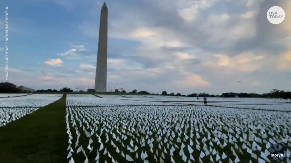 White flags representing COVID-19 deaths are being planted for a project called “In America: Remember.”