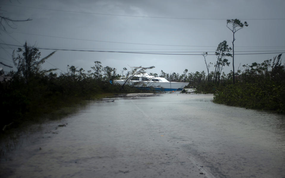 A catamaran thrown onshore by the hurricane lays stranded near a highway close to Freeport, Grand Bahama, Bahamas, Tuesday Sept. 3, 2019. (Photo: Ramon Espinosa/AP)