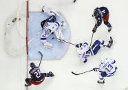FILE - Columbus Blue Jackets' Oliver Bjorkstrand, bottom left, of Denmark, scores against Tampa Bay Lightning's Andrei Vasilevskiy, of Russia, during the second period of Game 4 of an NHL hockey first-round playoff series, Tuesday, April 16, 2019, in Columbus, Ohio. Tampa Bay scored the first three goals of Game 1 against eighth-seeded Columbus before blowing that lead, falling behind in the series and getting unceremoniously swept out of the first round. (AP Photo/Jay LaPrete, File)