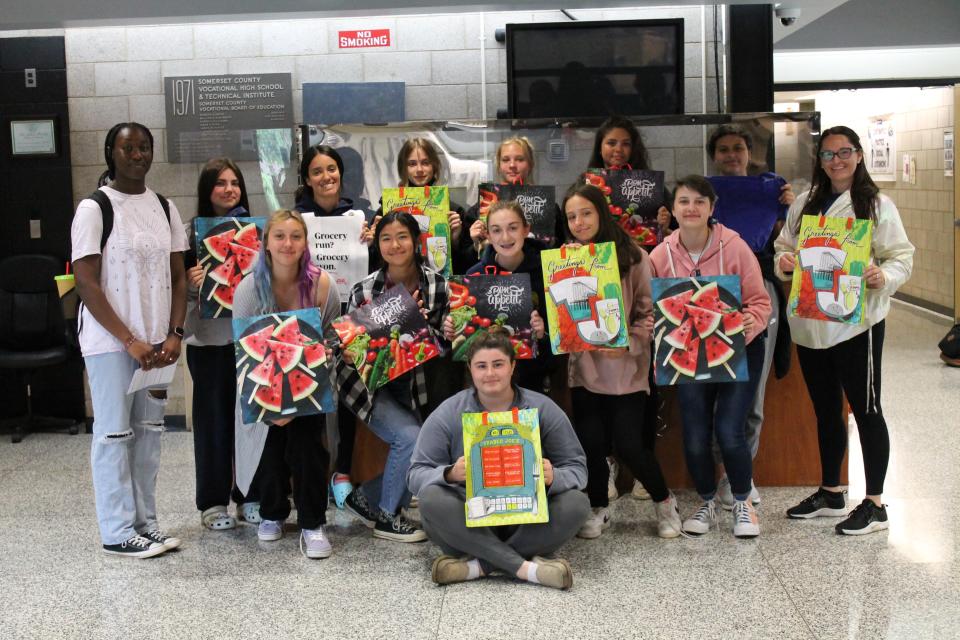 Posing for a photo with some of the reusable bags they collected are SCVTHS softball team members (back, left to right) Lee Ann Richards of Bound Brook, Samantha Killimett of North Plainfield, Emily Rosalli of Hillsborough, Madison Seibert of South Bound Brook, Sophia Davis of Branchburg, Sabrina Abella of Bridgewater, Gwenievere Nieves of Bound Brook, SCVTHS Softball Coach Brittany Maldonado, (middle, left to right) Karima El Attar of Manville, Isabella Granzetto of Bound Brook, Samantha Hanlon of South Bound Brook, Melissa McEnroe of Warren, Makayla Long of Bound Brook, and (front) Megan Norz of Hillsborough.