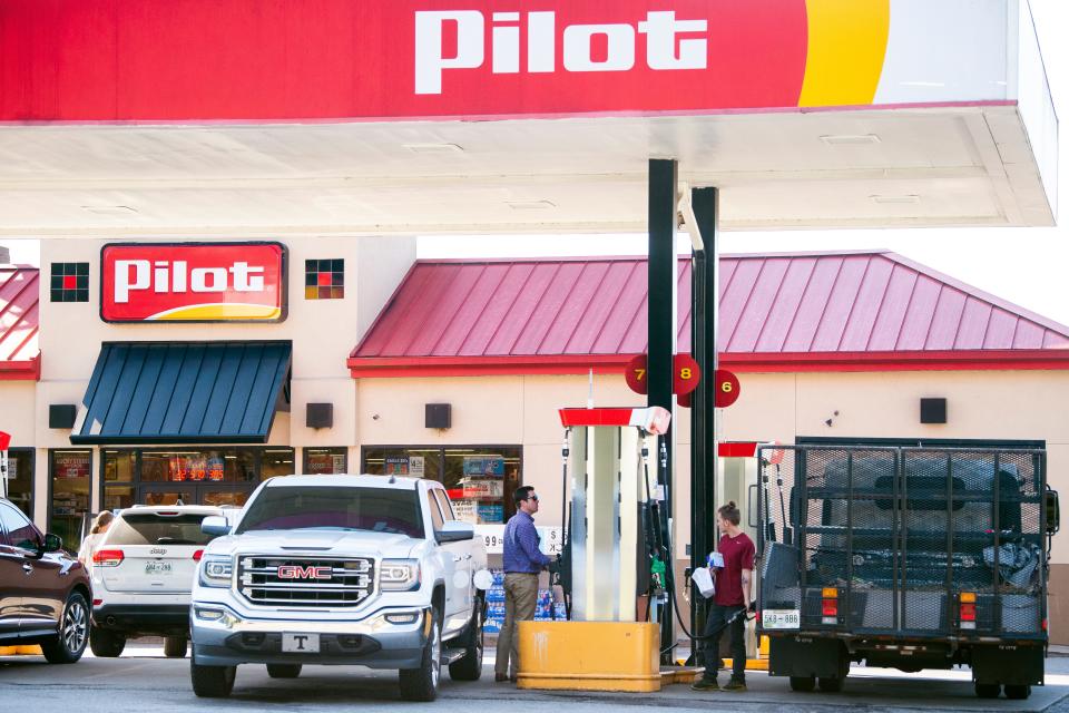 Customers pump gas at a Pilot gas station located at 136 N. Northshore Drive in Knoxville on Tuesday, Sept. 28, 2021. 