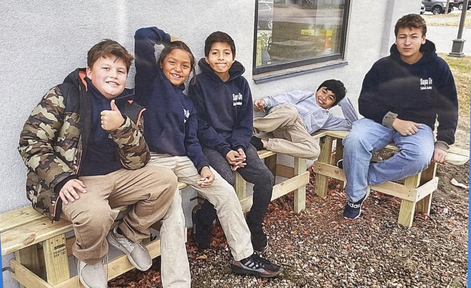 Honor Beauvais (center) fit in well with his classmates at Sapa Un Jesuit Academy in St. Francis, S.D., a Catholic-based academy that stresses Lakota language and culture.